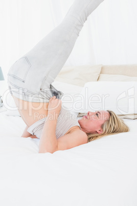 Blonde struggling to close her jeans