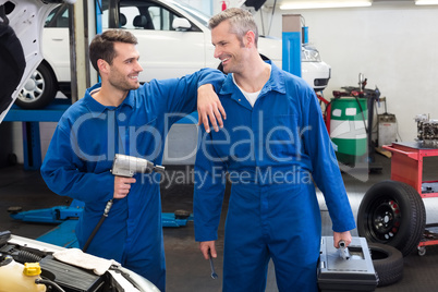 Team of mechanics working together Team of mechanics working together