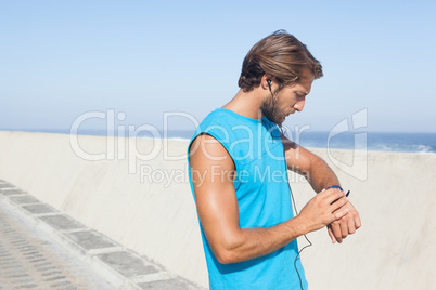 Fit man jogging on promenade