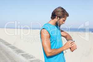 Fit man jogging on promenade