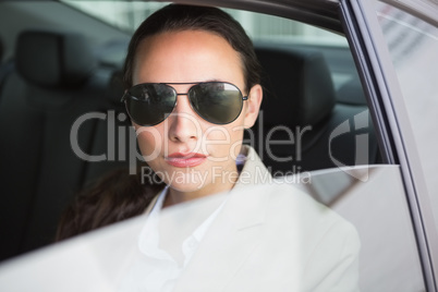 Woman wearing sunglasses looking at camera