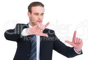 Happy businessman pointing with fingers