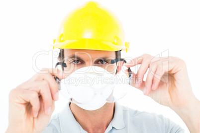 Worker wearing protective glasses over white background
