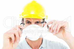 Worker wearing protective glasses over white background