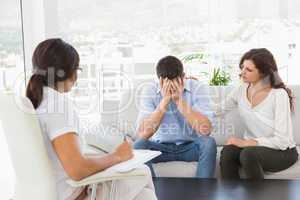 Depressed couple talking with their therapist