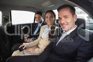 Business team working in the back seat