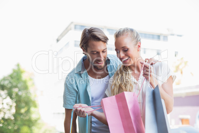 Attractive couple looking at shopping purchases