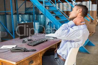 Warehouse manager working on computer