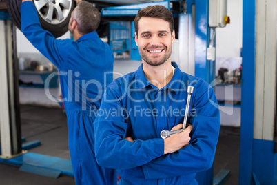 Mechanic smiling at the camera