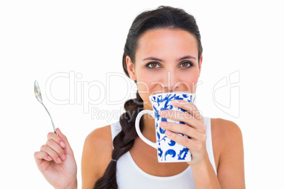 Pretty brunette having cup of tea