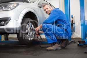 Mechanic adjusting the tire wheel