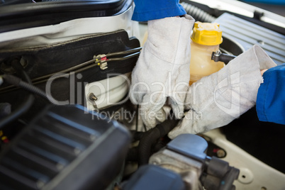 Mechanic working under the hood