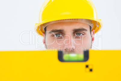 Male technician using spirit level