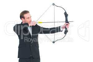 Businessman shooting a bow and arrow