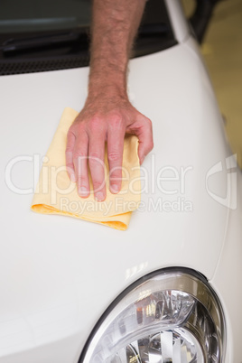 Close up of man cleaning his car