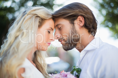 Attractive couple about to kiss each other