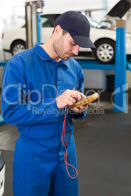 Mechanic using a diagnostic tool