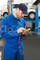 Mechanic using a diagnostic tool