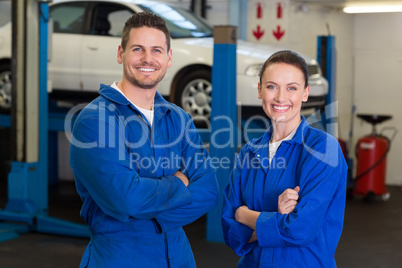 Team of mechanics smiling at camera