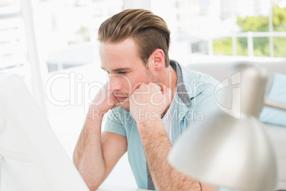 Focused businessman working with computer