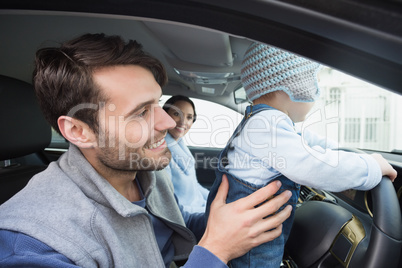 Parents and baby on a drive