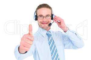 Positive businessman with headset end thumb up