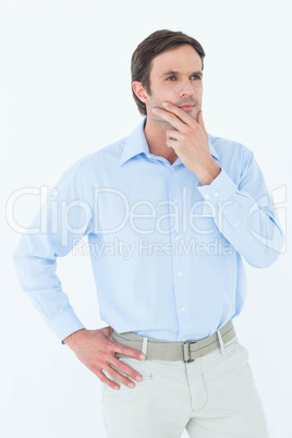 Businessman with hand on chin looking away