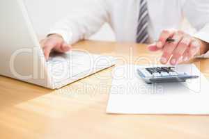 Businessman using his laptop