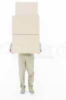Delivery man carrying stacked boxes