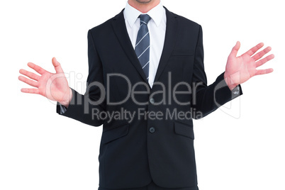 Well dressed businessman with hands up