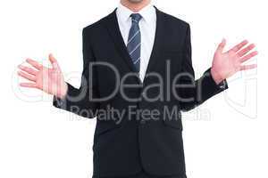 Well dressed businessman with hands up