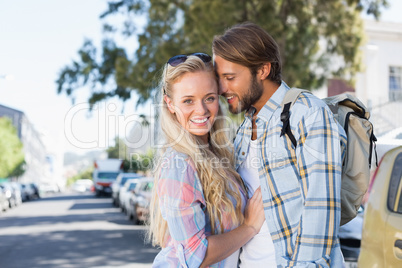 Attractive couple standing and hugging