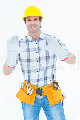 Happy male technician wearing gloves