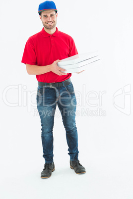 Happy delivery man holding pizza boxes