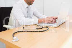 Businessman using his laptop