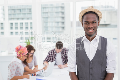 Casual businessman smiling at camera