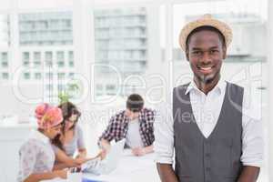 Casual businessman smiling at camera