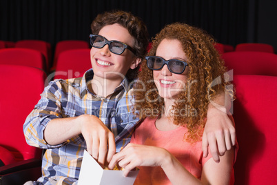 Young couple watching a 3d film