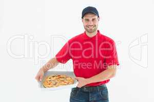 Happy delivery man holding fresh pizza