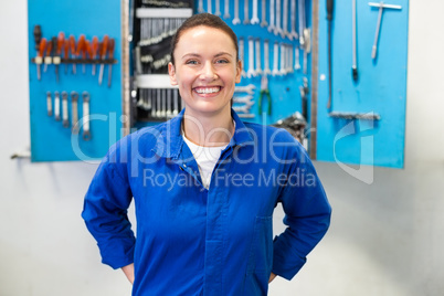 Smiling mechanic looking at camera