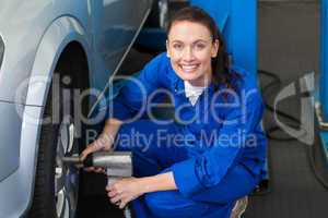 Mechanic adjusting the tire wheel