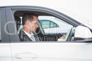 Serious businessman reading a map