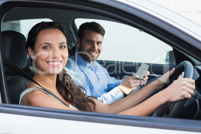 Young woman getting a driving lesson