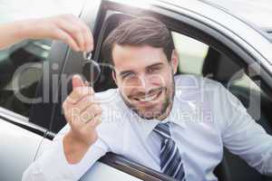 Businessman getting his new car key