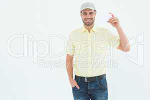 Happy delivery man holding blank card