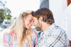 Attractive couple sitting on bench