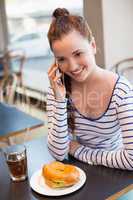 Young woman on the phone at lunch