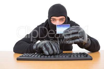 Hacker using card to steal identity