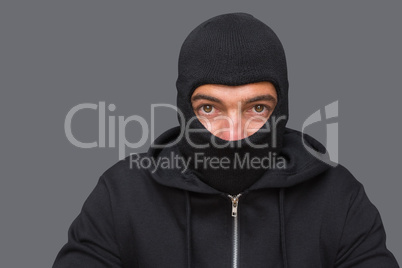 Man in balaclava looking at camera