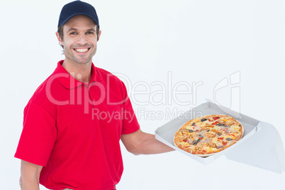 Happy delivery man holding fresh pizza